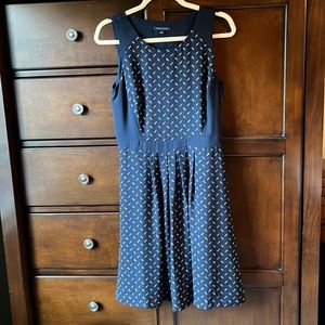 Navy, sleeveless, dress only worn once-  in excellent preowned condition.